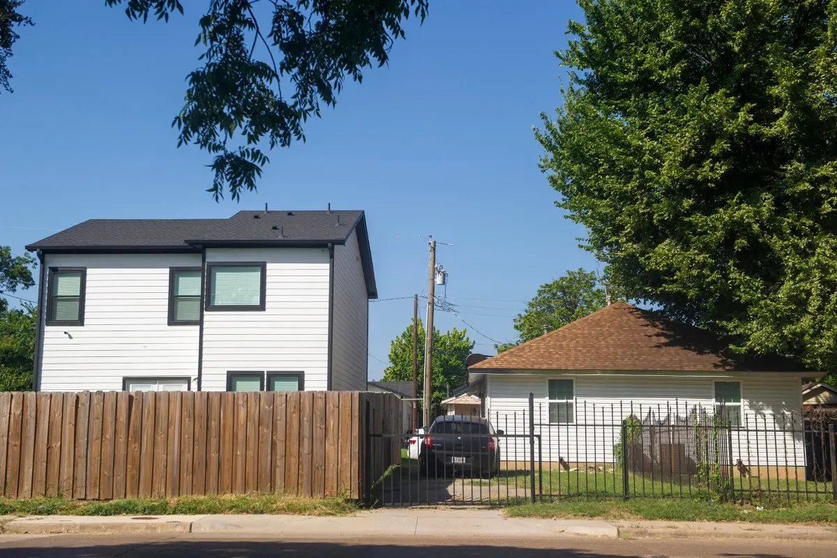 A recently built home sits next to another home in South Dallas on July 29, 2025.